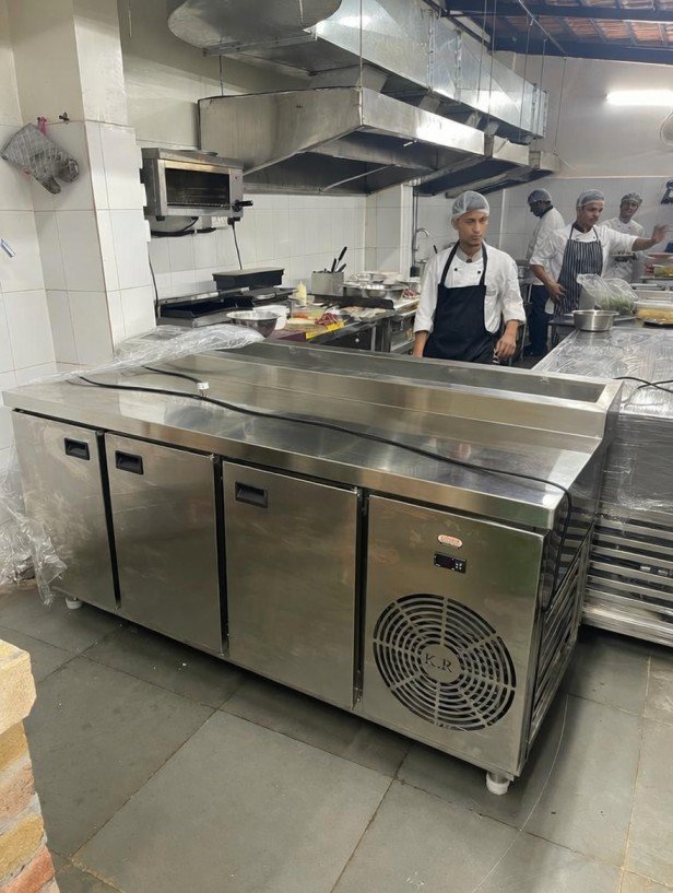 Commercial kitchen equipment supplier in Hyderabad, Telangana with stainless steel cooking range.
