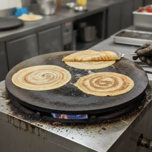 Commercial kitchen equipment supplier in Hyderabad, Telangana with stainless steel cooking range.