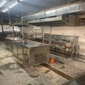 Hotel kitchen equipment manufacturer in Hyderabad, Telangana with oven and exhaust system.
