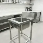 Commercial kitchen equipment manufacturer in Hyderabad, Telangana with oven and exhaust system.